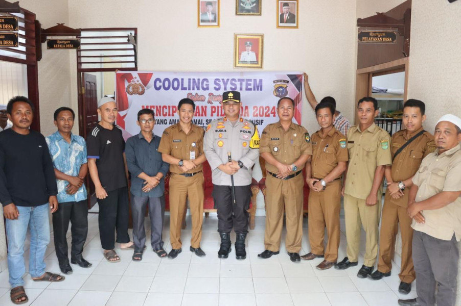 Kapolres Rohul Bersama Kepala Desa Laksankan Kegiatan Cooling System